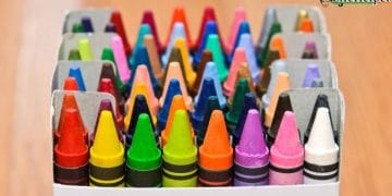 Collection of colorful wax crayons  in boxes