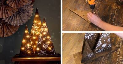 Из простой деревяшки и гирлянды можно сделать красивую новогоднюю композицию «Светящиеся ёлочки» - cpykami.ru